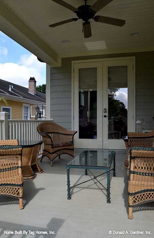 Inviting Patio with Wicker Seating and Double French Doors