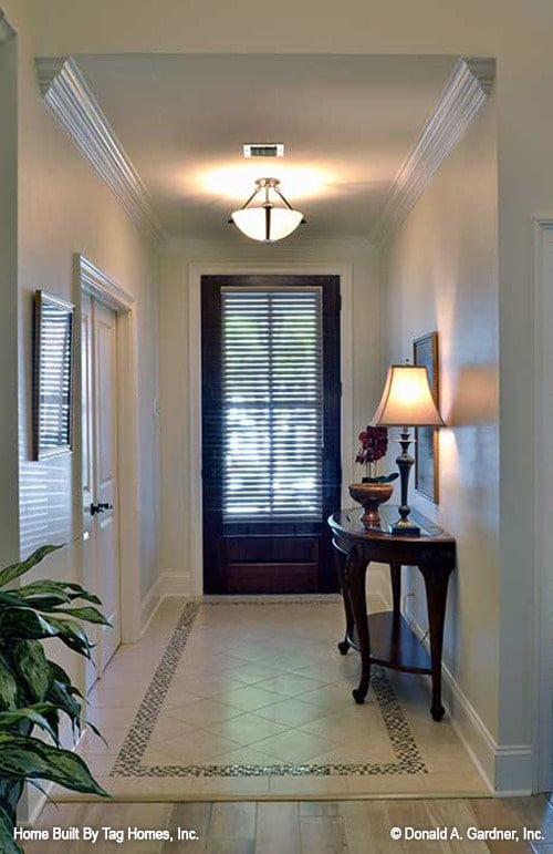 Welcoming Hallway Highlighted by Elegant Ceiling Light