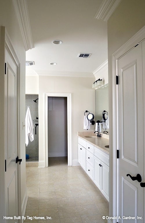 Bright Bathroom with Distinctive Dual Sinks and Ample Lighting