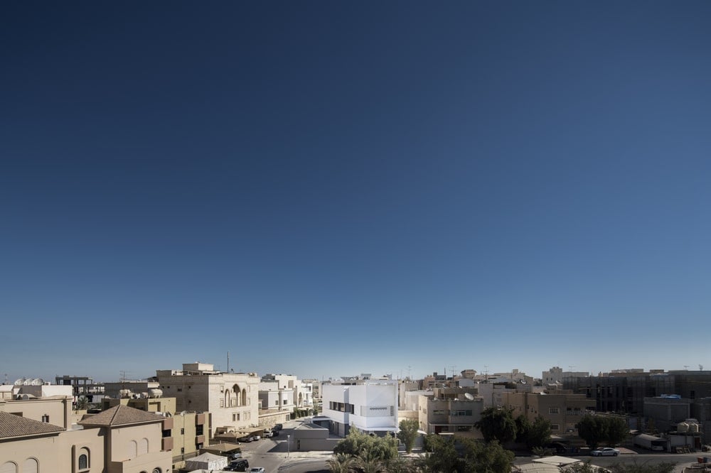This is an aerial view of the house showcasing how it stands out against the surrounding residential area.