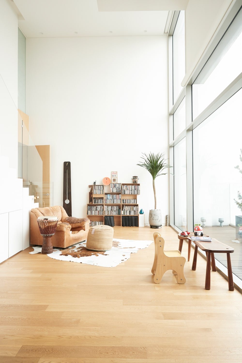 This is another look at the armchair facing the glass wall that lets in an abundance of natural lighting.