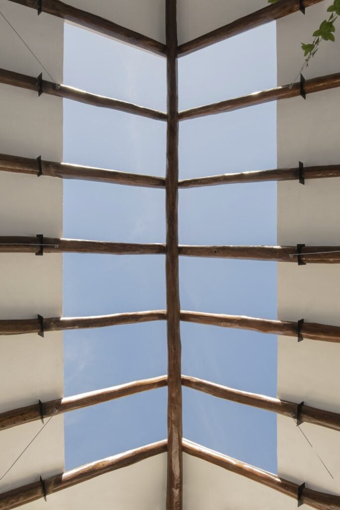 This is then topped with a large skylight adorned with beams of bamboo.
