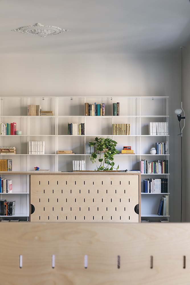 This is a close look at the house's miniature library with a large bookshelf and a reading nook.