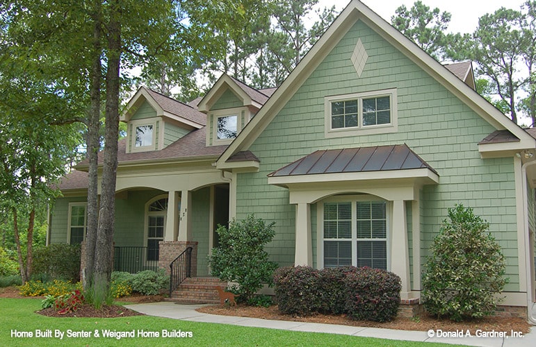 Charming Light Green House with Architectural Details