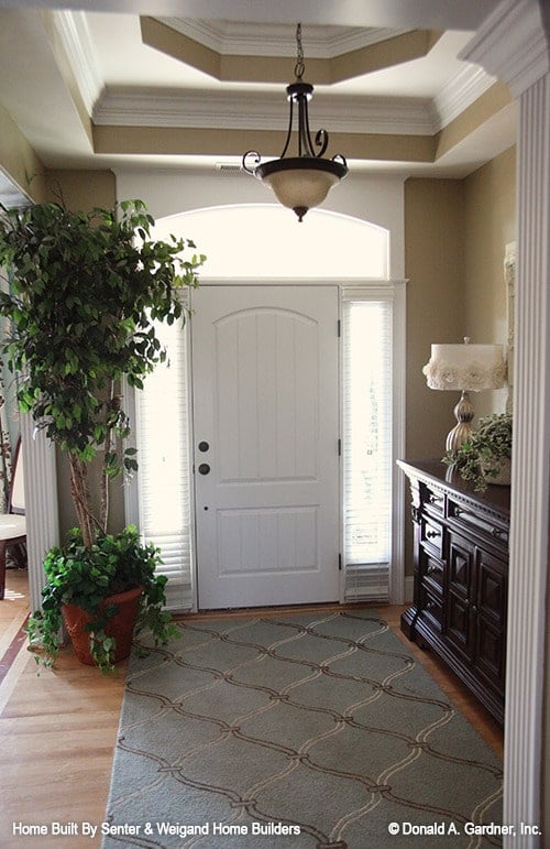 Inviting Entryway with Tall Windows and Classic Chandelier