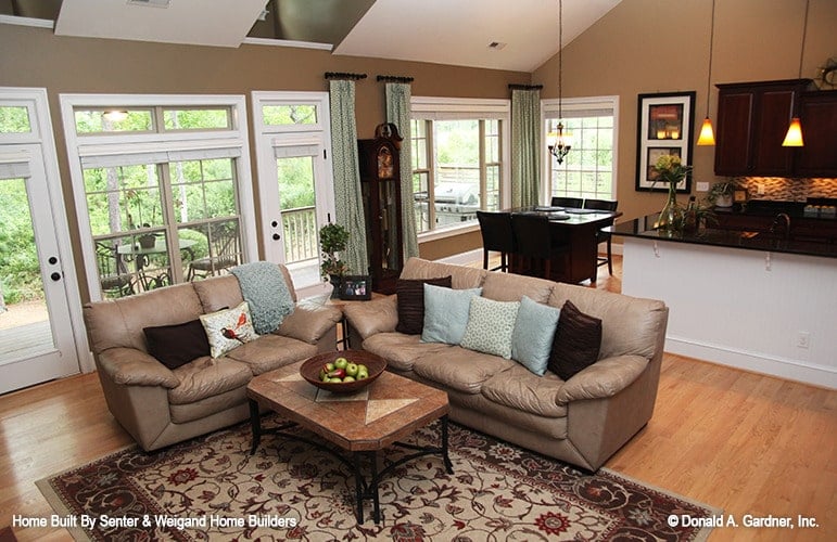 Bright Living Room Seamlessly Connects to Kitchen Area