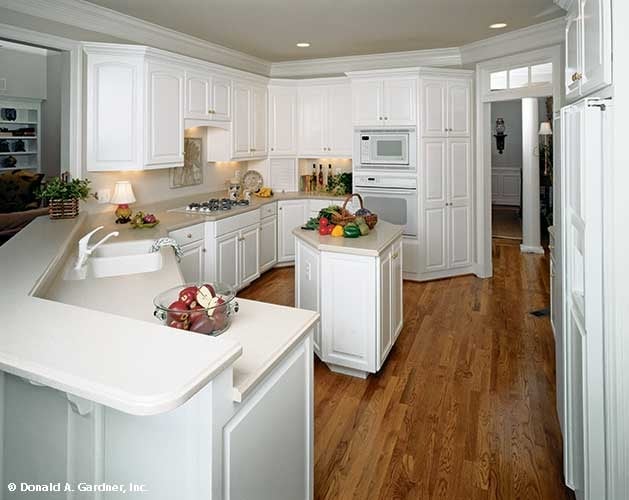 Modern Kitchen with Functional Island and Wood Floors