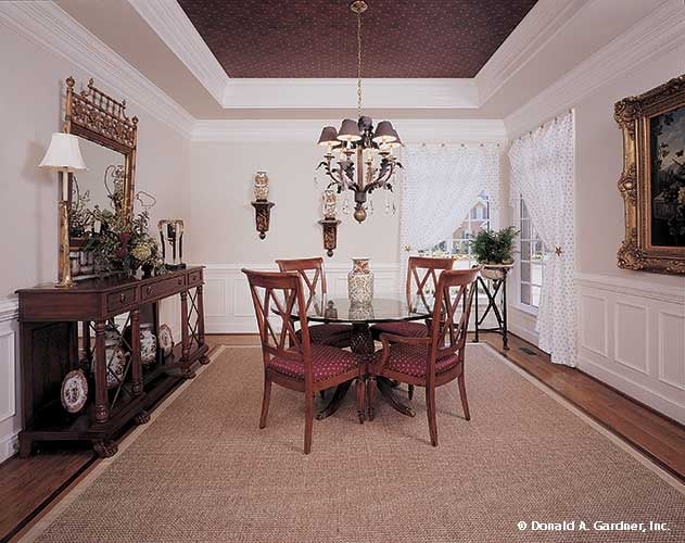 Elegant Dining Room with Glass Table and Chandelier