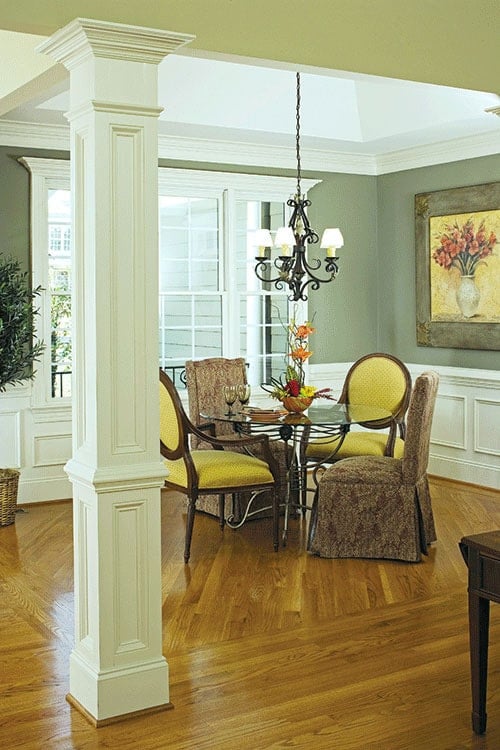 Elegant Dining Area with Mixed Seating and Artful Accents