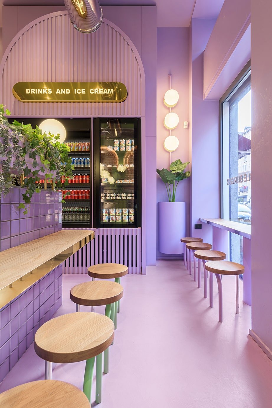 On the far wall of the purple side of the restaurant is the large built-in fridge for the various drinks and beverages the restaurant offers.