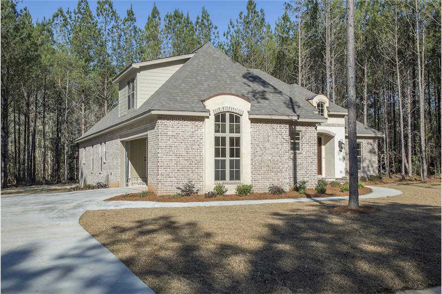 Left exterior view with a side-entry garage complemented with a concrete driveway.