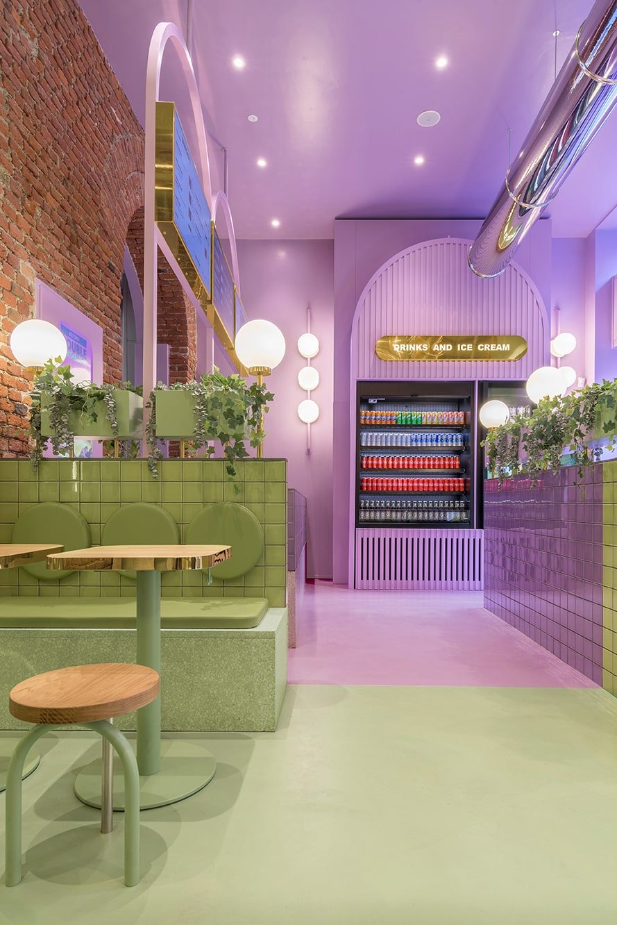 This view of the restaurant showcases more of the boundary of the green area and purple area complemented by the warm lighting.