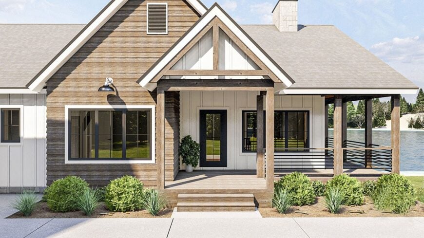 Entry porch with wooden posts, decorative trims, and a glazed front door.