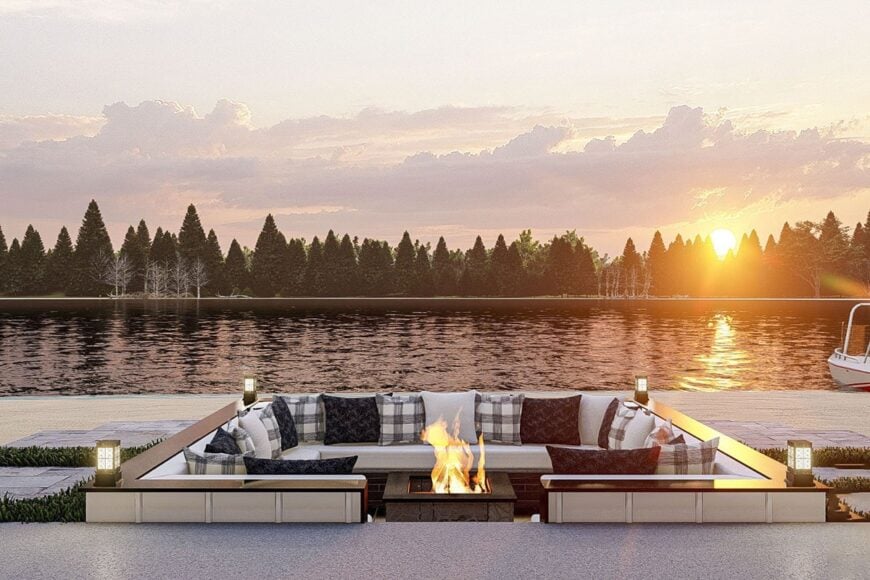 An open patio with built-in seats wrapping around the fire pit