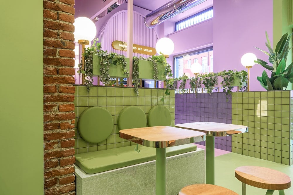 This is another look at the green and purple tiles of the dividers on the far side. This also shows the cushions on the backs of the built-in benches topped with vines.