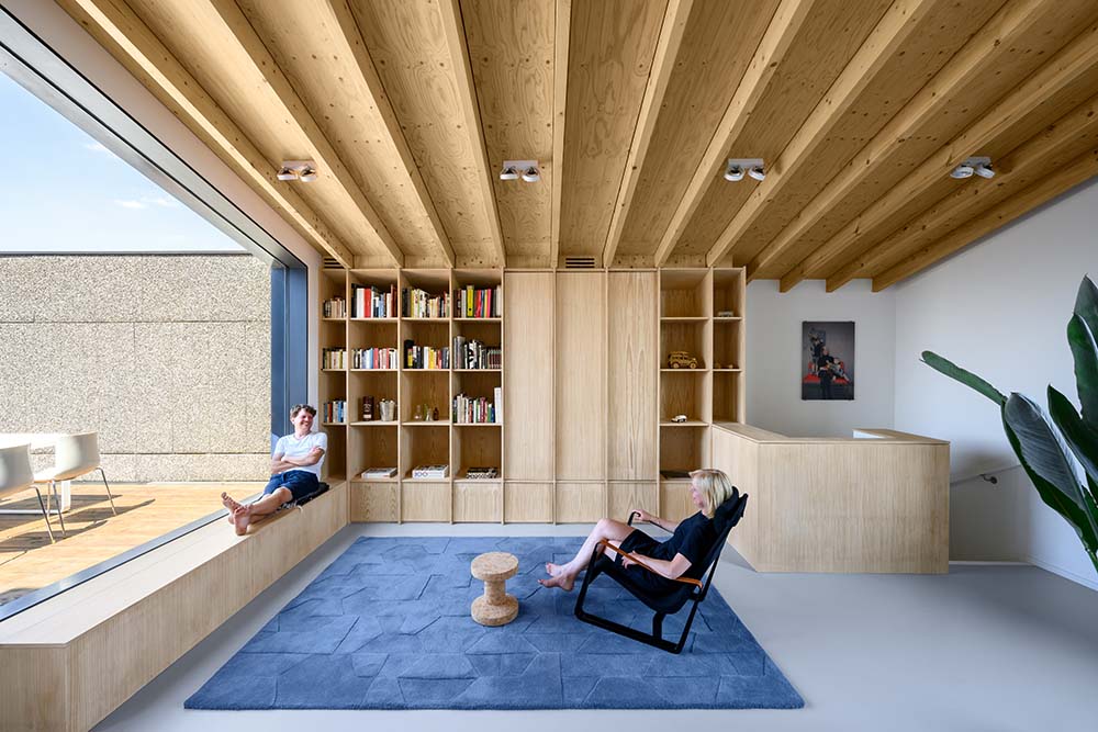 This is the other side of the top level with built-in bookshelves and a reading nook under the window.