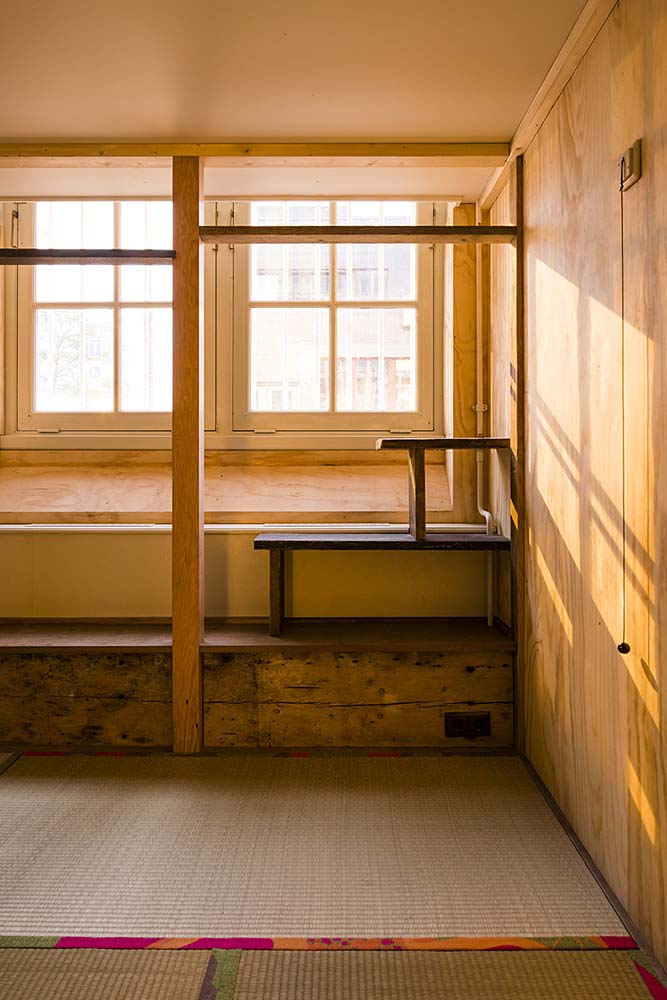 This is a closer look at the built-in wooden shelves on the side of the bench and the window perfect for the reading nook.
