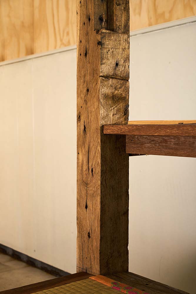 This is a close look at one of the thick wooden beams and pillars that support the area.