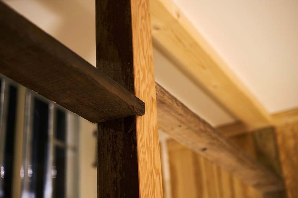This is a close look at one of the thick wooden beams and pillars that support the area.