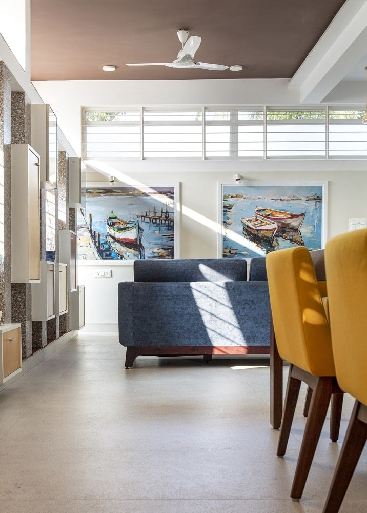 This is a look at the living room area just a few steps from the dining area with a couple of colorful wall artwork.