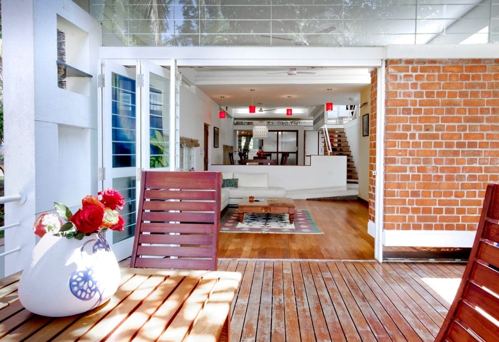 This wooden deck terrace is just outside the folding glass doors of the living room.