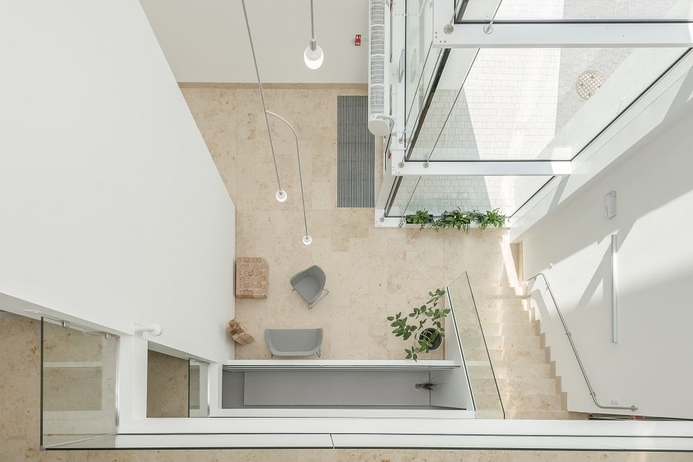 This is a look down onto the lobby and atrium of the monastery from the vantage of the top indoor balcony.