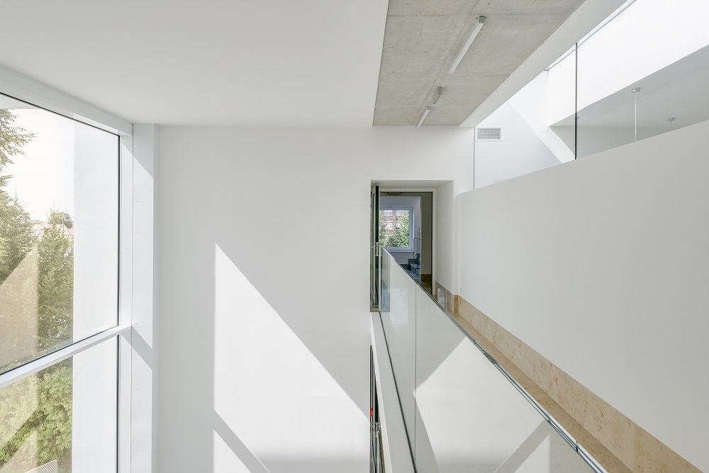 This is another look at the top indoor balcony looking over the lobby with glass railings and skylights on the side.