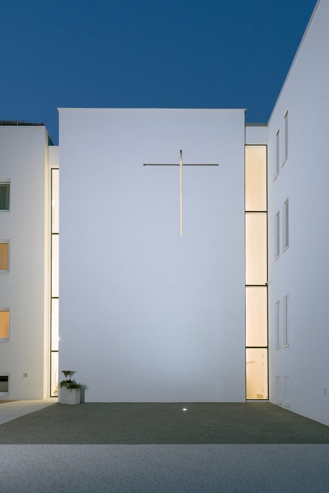 The crucifix symbolism of the exterior wall stand out against the large wall.