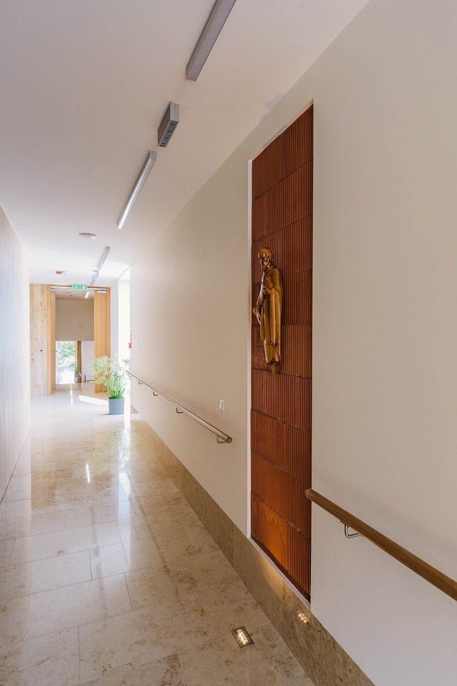 This is a look at one of the hallways of the interior with hand rails on the side.
