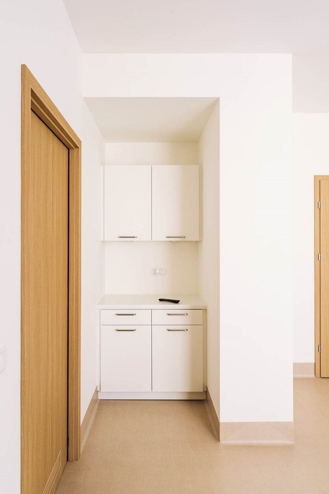 This is a set of built-in cabinets on the side of the door.
