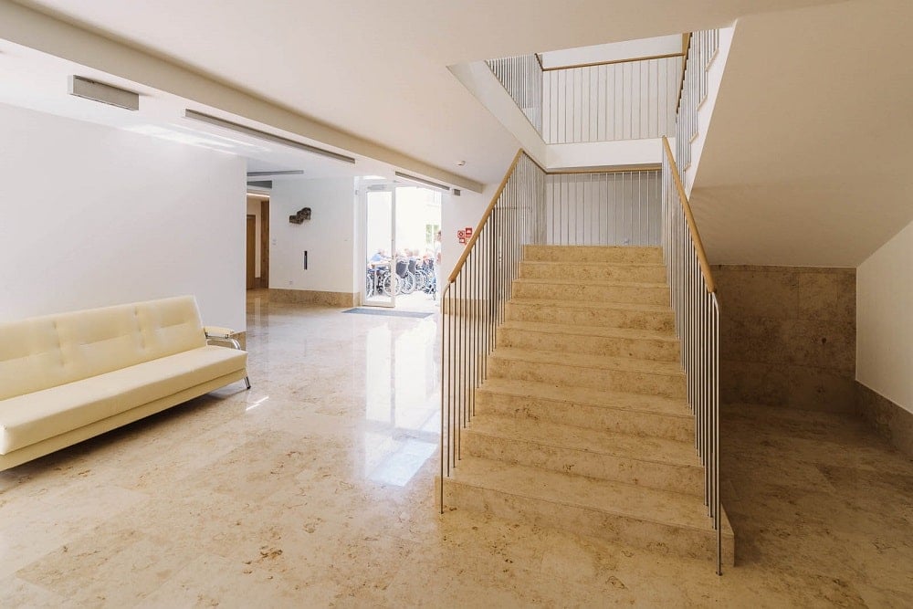 This is a close look at the staircase of the interior as well as the wide halls.