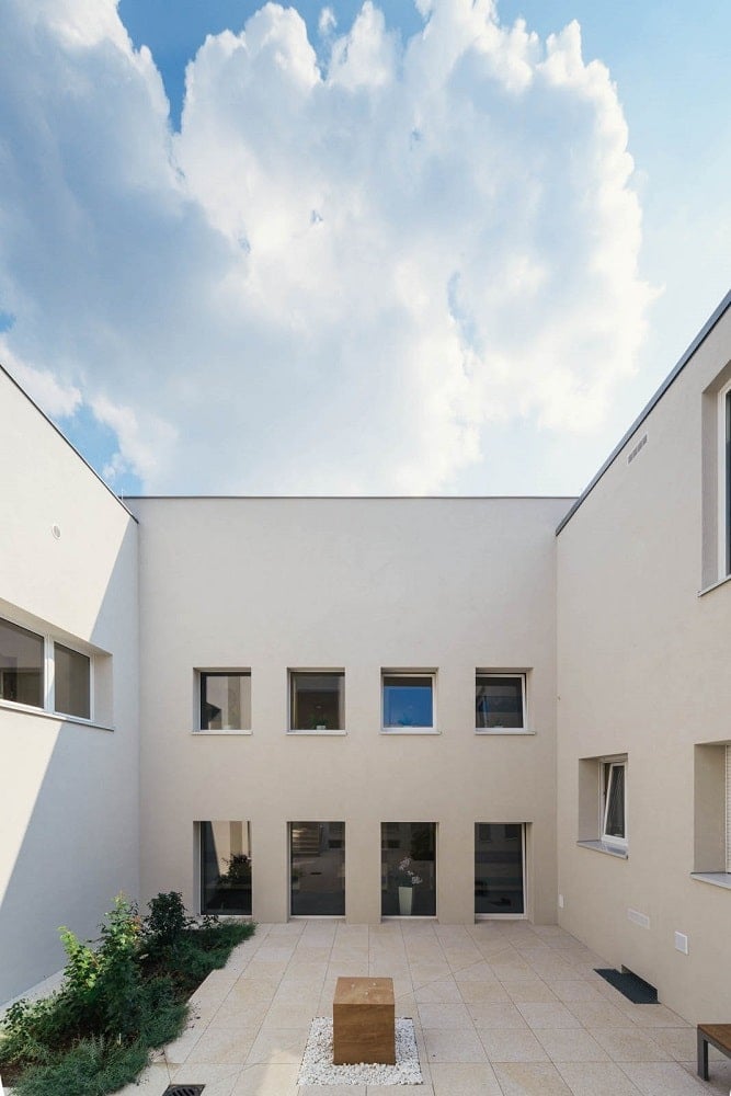 This is a closer look at the exterior courtyard of the senior house witha miniature garden on the side.