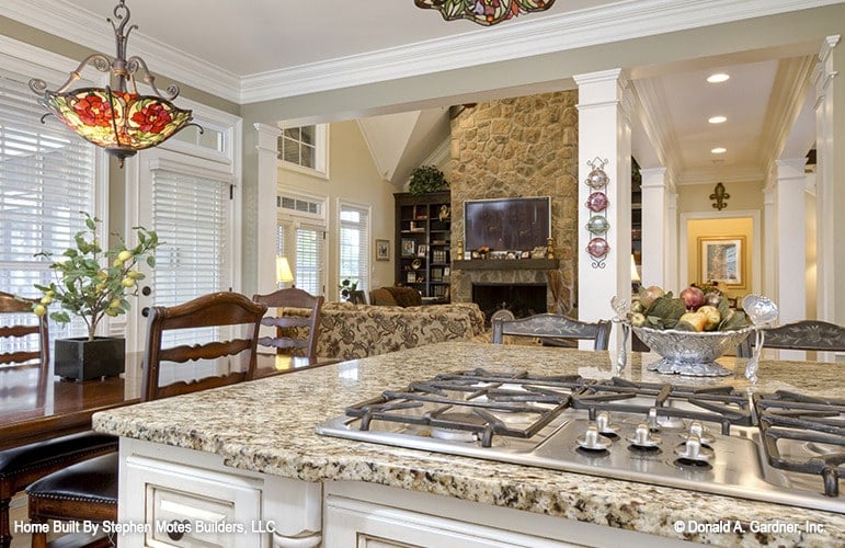 A close-up look at the kitchen island fitted with a built-in cooktop.