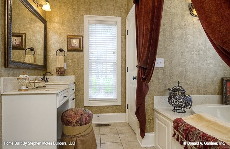 The primary bathroom includes a sink vanity with a makeup counter.