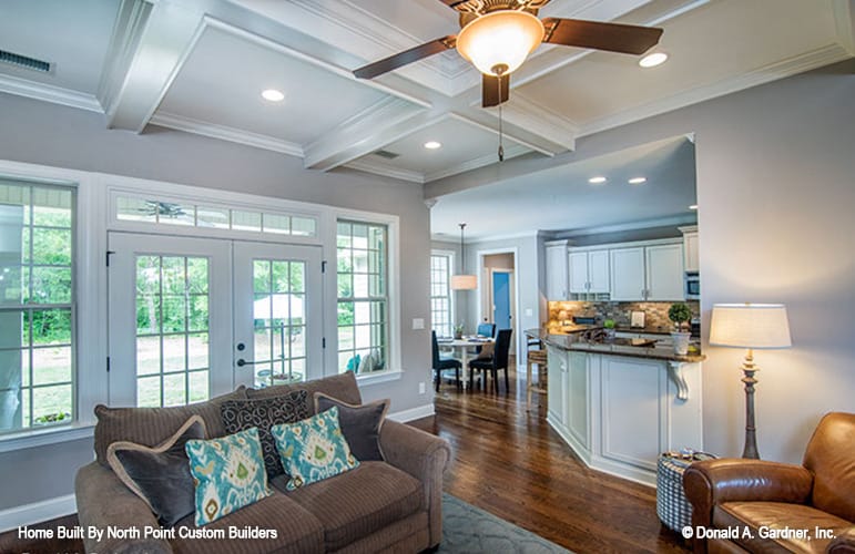 An open layout view showing the living area, kitchen, and dining area.