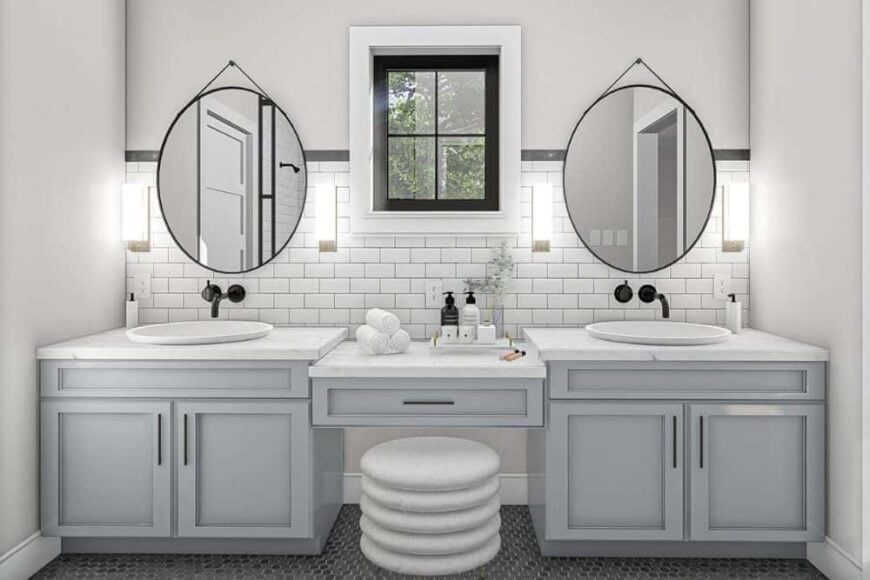 The primary bathroom features a dual sink vanity with a makeup counter in the middle paired with a round stool.