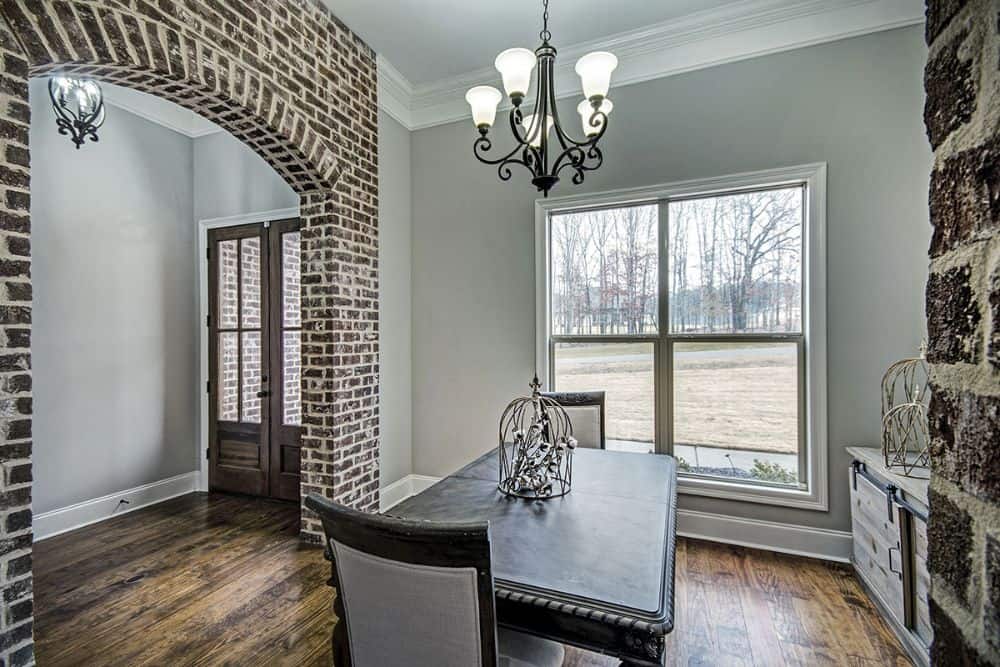 A large framed window brings natural light into the dining area.