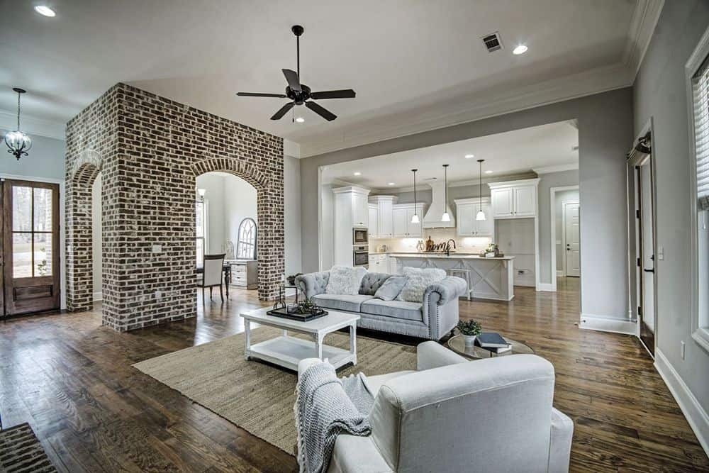 A free-flowing layout showing the foyer, living area, kitchen, and dining room.