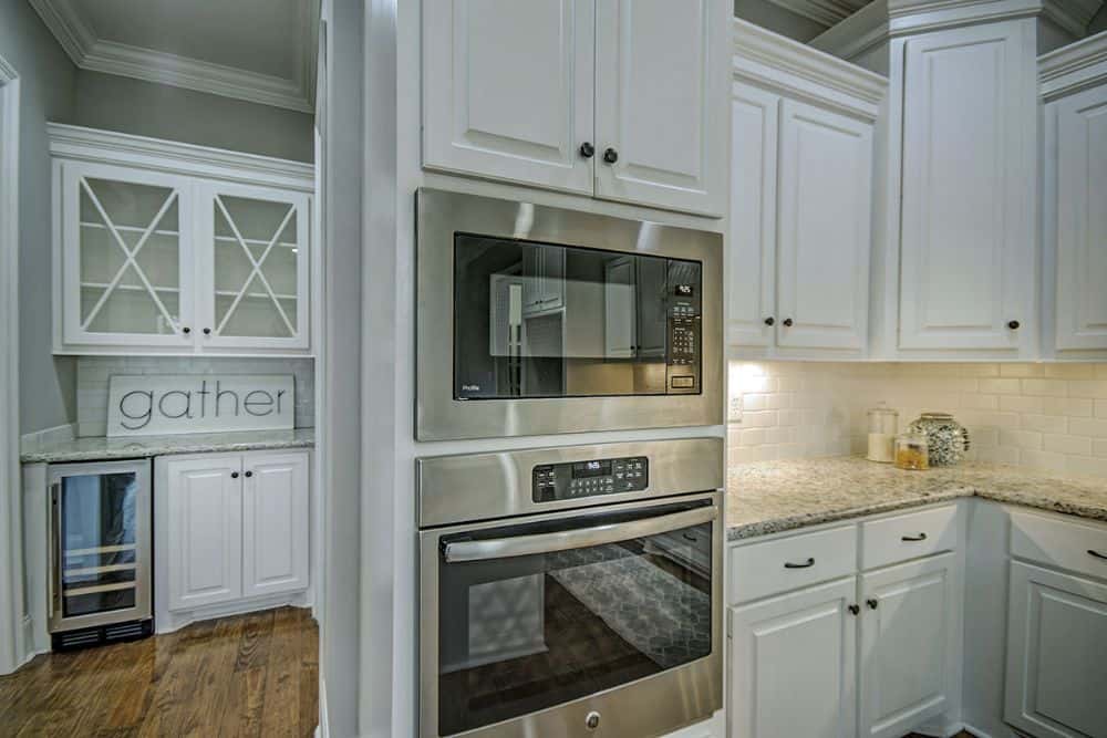 At the back of the kitchen is a butler's pantry with a bar and wine fridge.