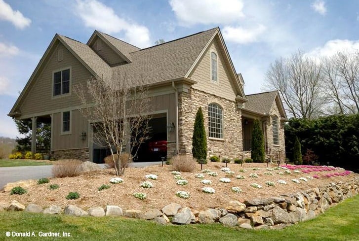 A desert landscaping complements the craftsman home.