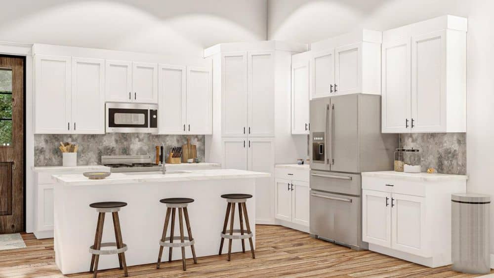 The kitchen has white cabinetry, slate appliances, and a breakfast island paired with round bar stools.