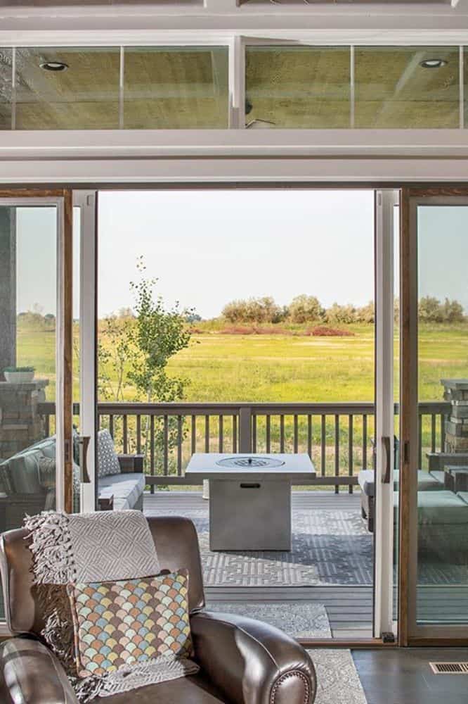 Sliding glass doors extend the living space onto the rear deck.