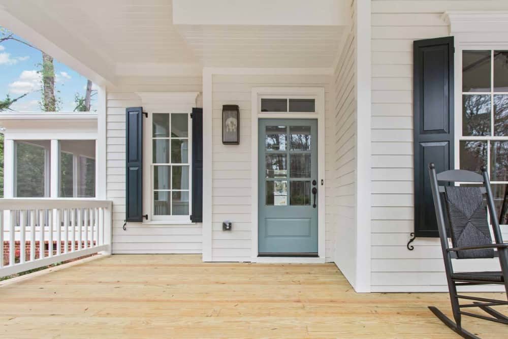 A gray front door welcomes you inside.