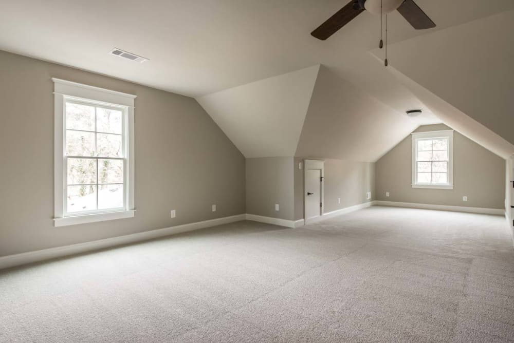 The bedroom includes a storage closet and a couple of windows.
