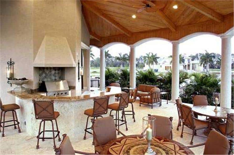 Covered lanai with a summer kitchen and multiple dining and sitting areas.