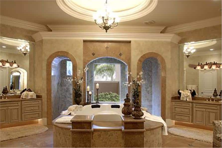 Primary bathroom with his and her sink vanities, a deep soaking tub, and a spacious shower area with window.