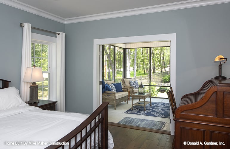The primary bedroom includes a wooden desk and a sitting room.
