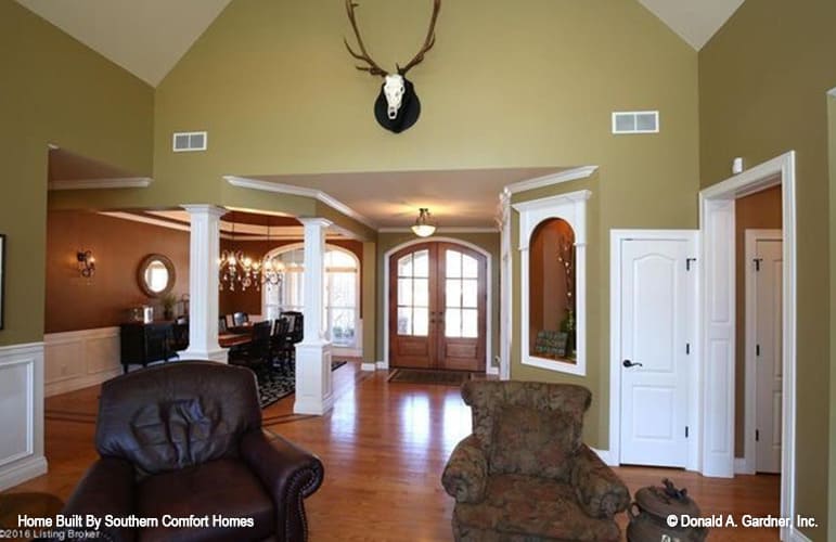 An open layout view showing the great room, foyer, and dining room.