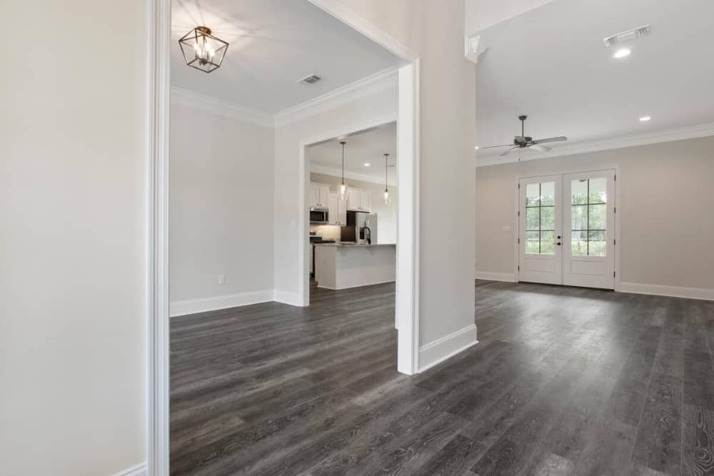An open doorway to the left side of the foyer opens into a flex room.