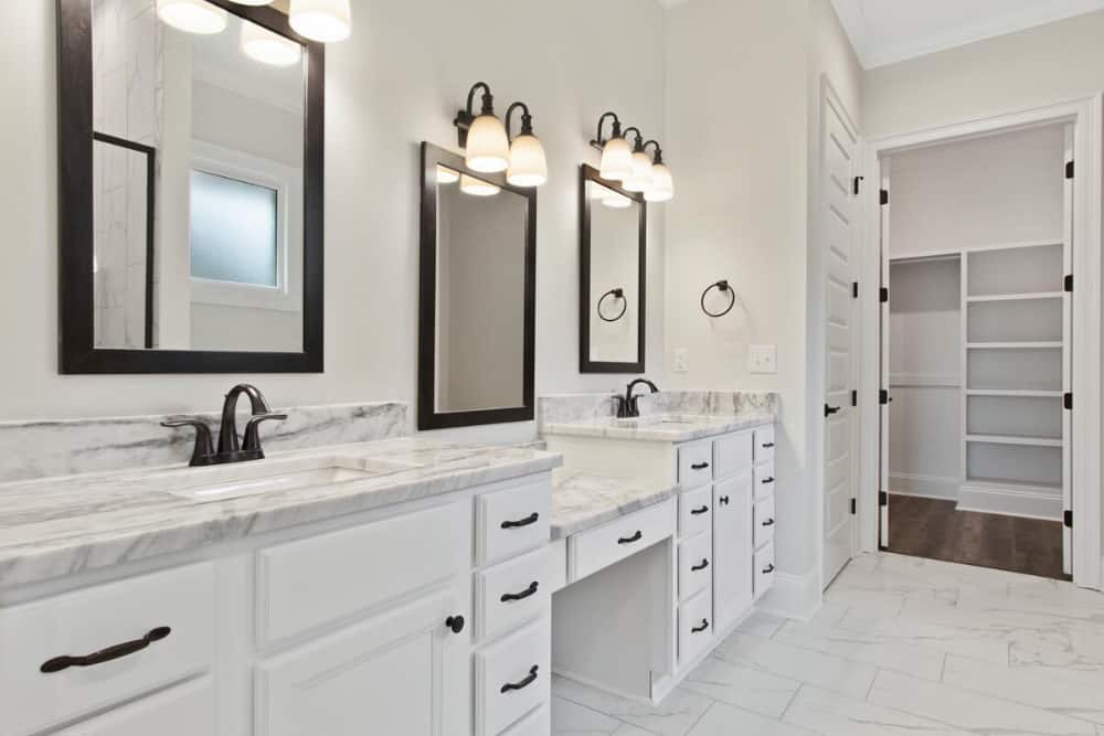 Beyond the vanities are the linen and walk-in closets.